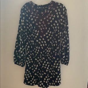 Black and white romper with eyelet detail.